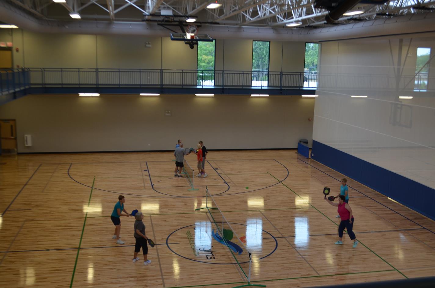 Adults Playing Indoor Tennis